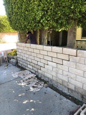 Slump Stone Block Wall rebuild after vehicle impact.