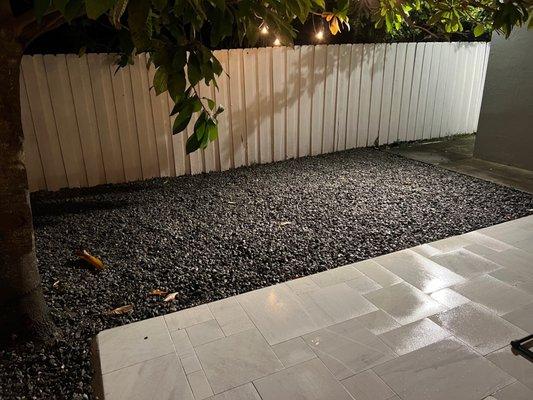 After: trimmed mamey tree and covered dead grass with grey pebbles.