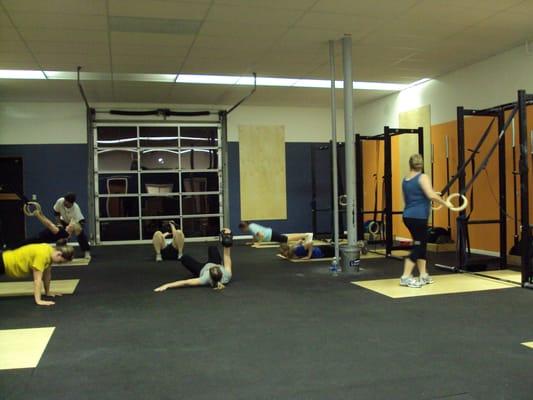 Bridgetown CrossFit Women completing a WOD at 6am Class