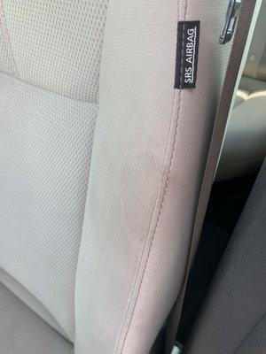 Grease stain on side of driver's seat