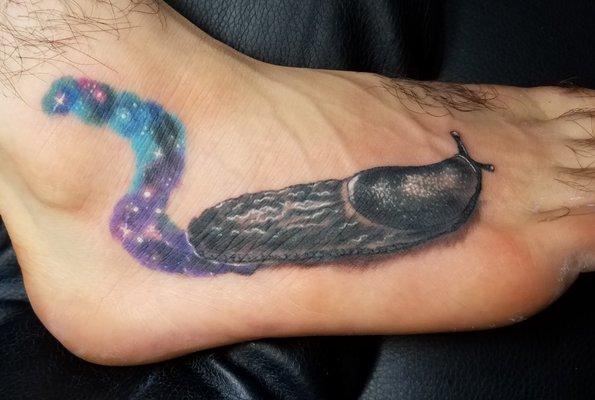 Universal space slug tattoo by Joe Bass @ Happiness Tattoo