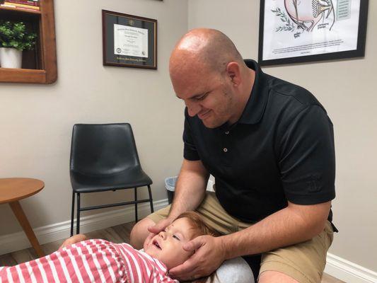 Gentle Pediatric Chiropractic adjustments (No masks because patient is Dr's child)