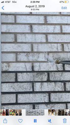 Pressure washing brick home