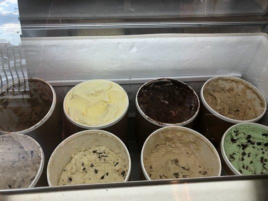 Flavors of ice cream. Large variety but flavors not labeled.