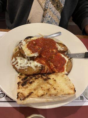 The eggplant Parmesan with spaghetti and garlic bread