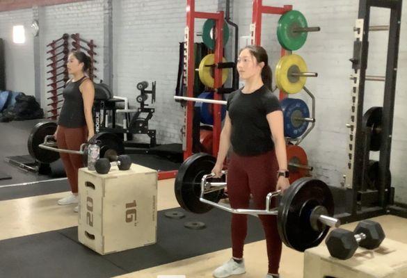 High School Fencers performing as many reps possible on their trapbar deadlift