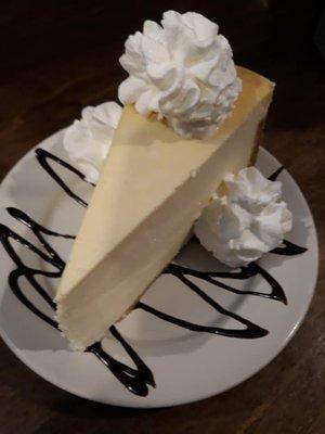 Cheesecake with choice of raspberry, Chocolate, or Carmel drizzle and whipped Cream