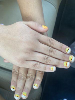 Candy corn nails with eyeballs