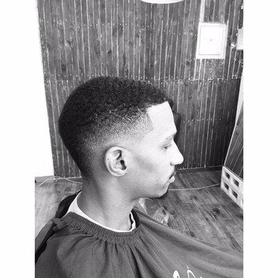 Low skin fade with a Mohawk in the back