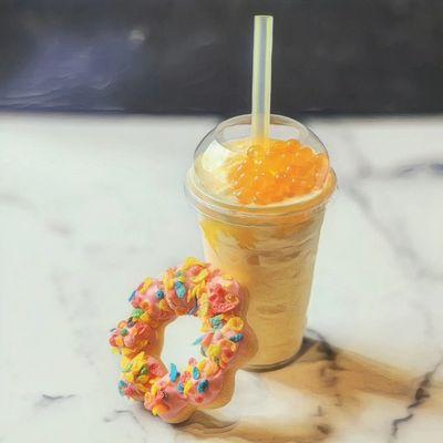 Mango smoothie with a mochi donut