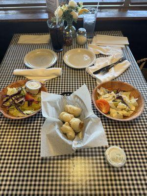 Side salads one with blue cheese, the other with ranch.