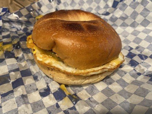 Breakfast sandwich- sausage, egg and cheddar on a plain bagel