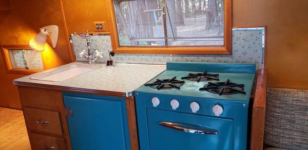 Restored Appliances and New Counter Laminate and Retro Aluminum Edge Band.