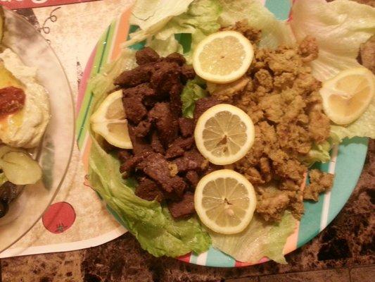 Mixed chicken shawirma with lamp gyro over salad