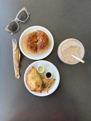 Breakfast bagel, spinach feta & ratatouille empanada w/ a Tatlicious Almond