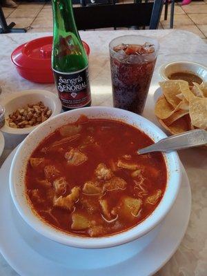 Sunday morning menudo with a side order of chopped fried garlic ( I love that in my menudo) , chips and soda. Sabroso.