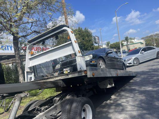 Towing car to repair shop.