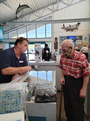 Rich D. helping my dad at the display case