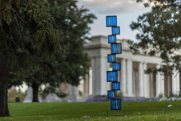 Blue Tower Fused glass and steel outdoor sculpture. Helen Rudy Glass. Photo taken in Cheesman Park, Denver, Colorado