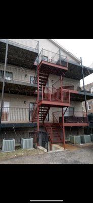 In process of completing primer on metal porch.