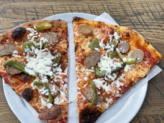 Two slice special with sausage and peppers.