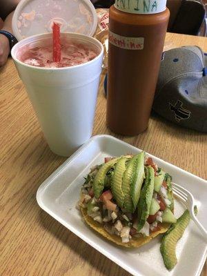 Ceviche tostada with a side of fresh watermelon water.