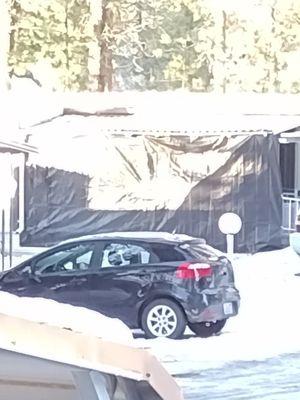 Giant plastic tarp hanging from roof for wind/rain protection. I was given a warning letter for a tiny piece of plastic hanging from lattice