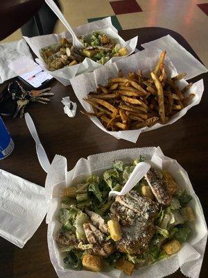 Basket of fries & two large chicken ceasar salads!