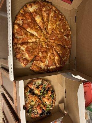 Large pepperoni pizza and personal veggie pizza.