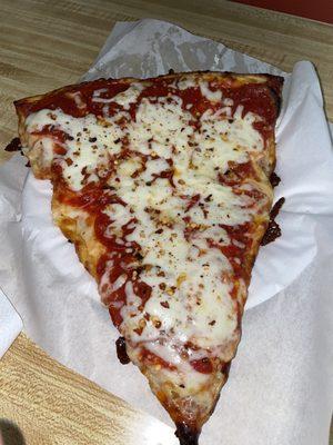 Giant slice of pepperoni pizza.