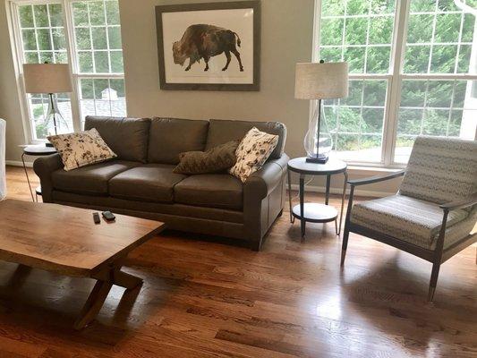 A section of our designed family/great room.  Window treatments and a rug will enhance.  -sorry about the pens on the table.