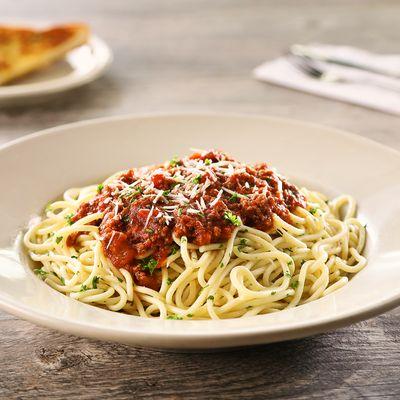 Spaghetti - A generous portion of pasta topped with our hearty meat sauce with the perfect blend of seasonings, served with garlic toast.