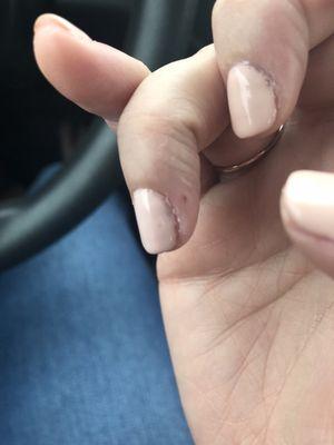 One out of seven nails that has an air bubble.