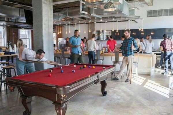 Yelp employees playing pool at Yelp HQ