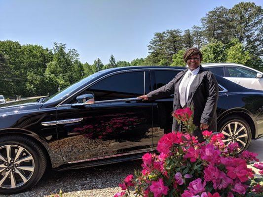 Chauffeur is showing off our Continental.  Wedding packages start at $200.00 with red carpet, just married signs and bottle of champagne.