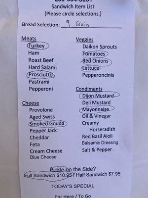 To order, select the bread, meat(s), and other toppings using the paper sheets available in the store