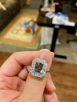 Visible scratch at the base of the aquamarine stone after David set it in the ring setting.