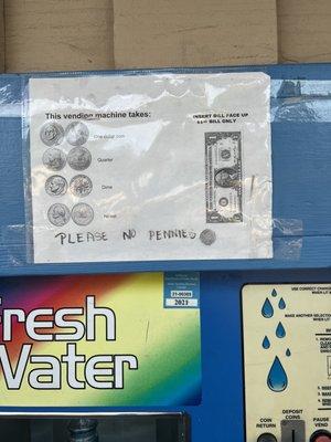 Outside water dispenser money intake