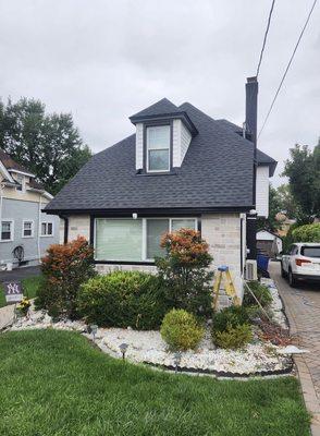 Exterior siding painting and window trim replacement.