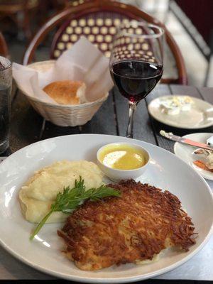 Potato crusted flounder, mashed potatoes, wine, and bread