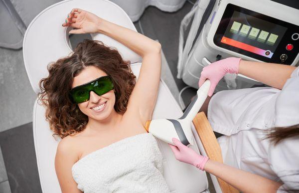 Receiving professional laser hair removal at Georgetown Rejuvenation, showcasing smooth, long-lasting results compared to shaving armpits