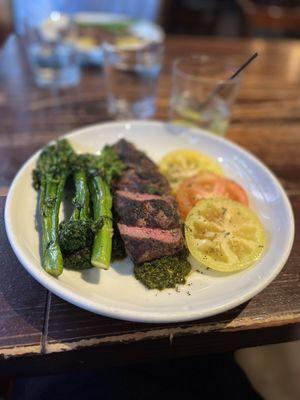 Flank steak w bomb chimichurri sauce, broccolini, and fresh tomatoes