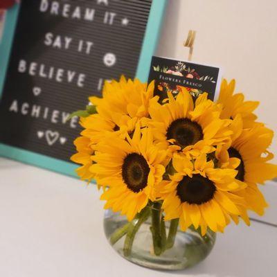 Sunflower arrangement with round jar