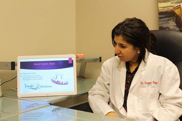 Dr. Farzana Rahman consulting with a patient.