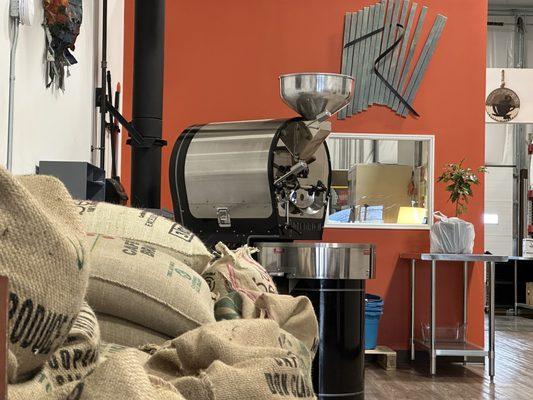 Coffee beans stacked by the roaster.