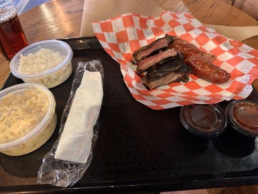 Burnt and dried out ribs, nasty sausage, bland coleslaw, lame Mac n cheese