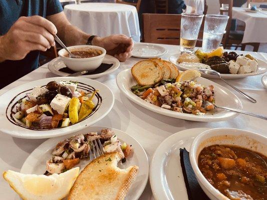 Soup, octopus salad,  cheese and olives