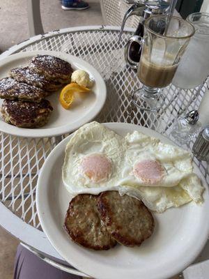 eggs, sausage, pancakes and hot chocolate