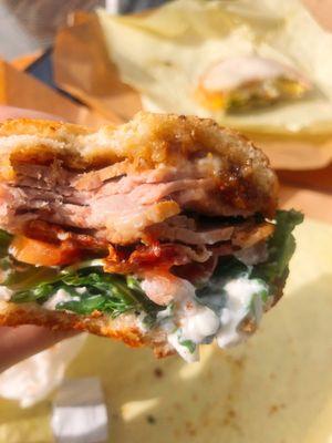 Anholm Sweet Home insides -- roast beef, bacon, tomato, arugula, goat cheese, and fig jam on Dutch crunch bread