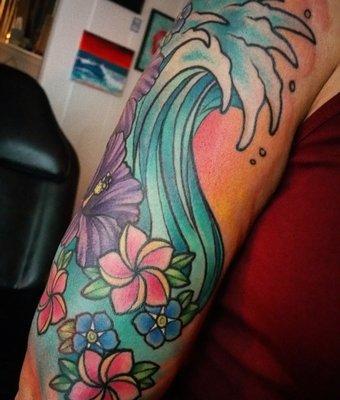 Nicole specializes in bold, bright color tattoos.